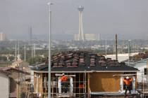 Construction workers build a home near Vegas Valley Drive and S. Hollywood Boulevard in Las Veg ...