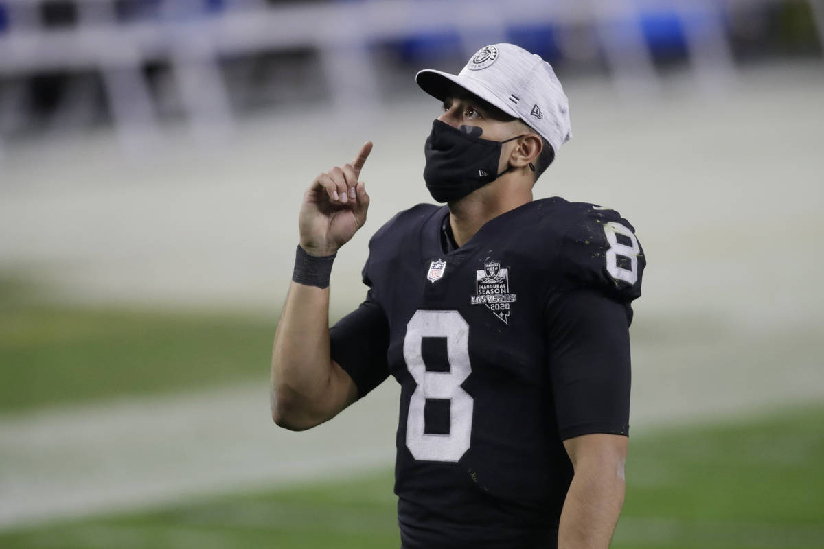 Las Vegas Raiders quarterback Marcus Mariota (8) after an NFL football game against the Los Ang ...