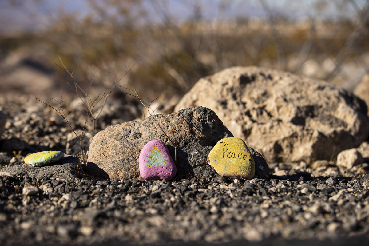 Painted rocks with positive messages line the Nevada Power Trail in Henderson. (Chase Stevens/L ...