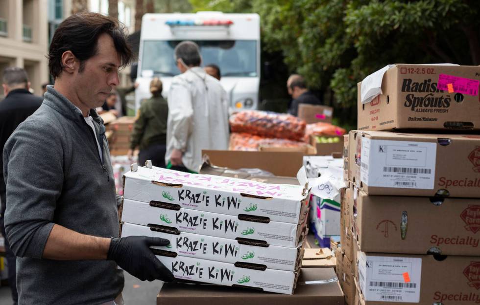 Anthony Amoroso, corporate executive chef for MGM Resorts, unloads items for donation to those ...