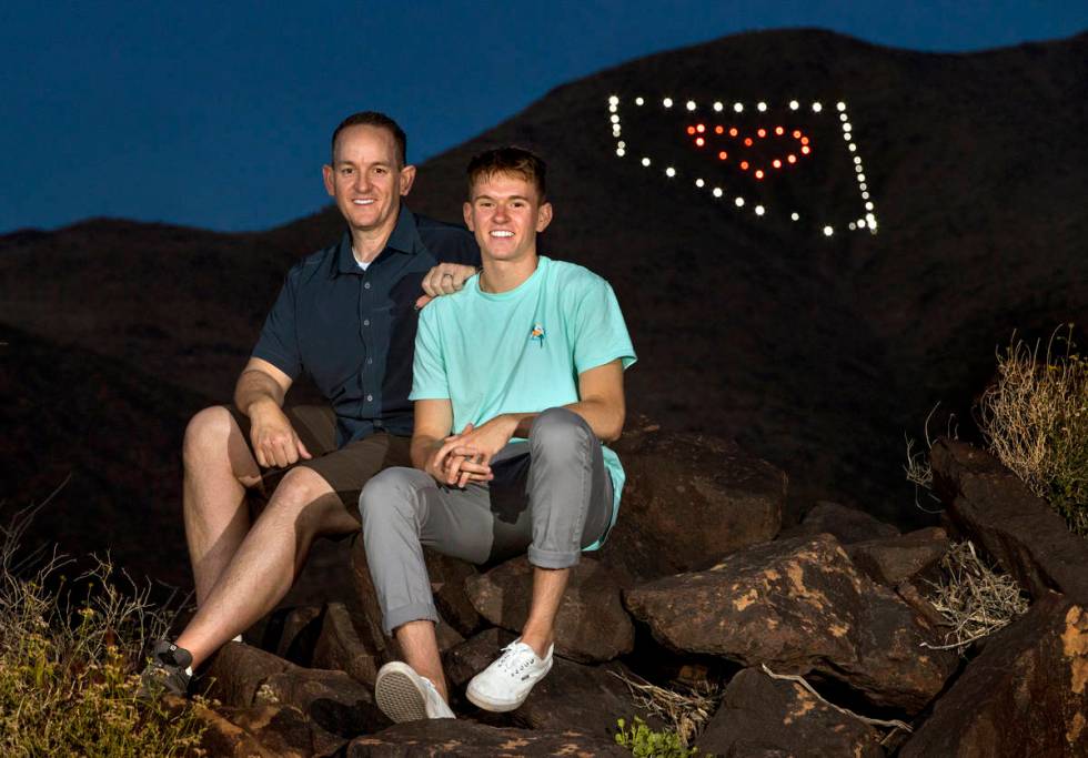 David Koch and son Mason at the trailhead below the Nevada light display they created on Black ...