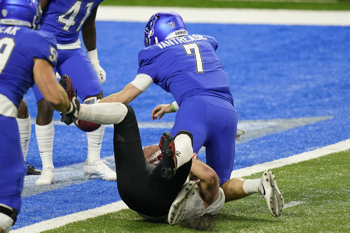 Buffalo quarterback Kyle Vantrease (7) falls into the end zone for a touchdown during the first ...