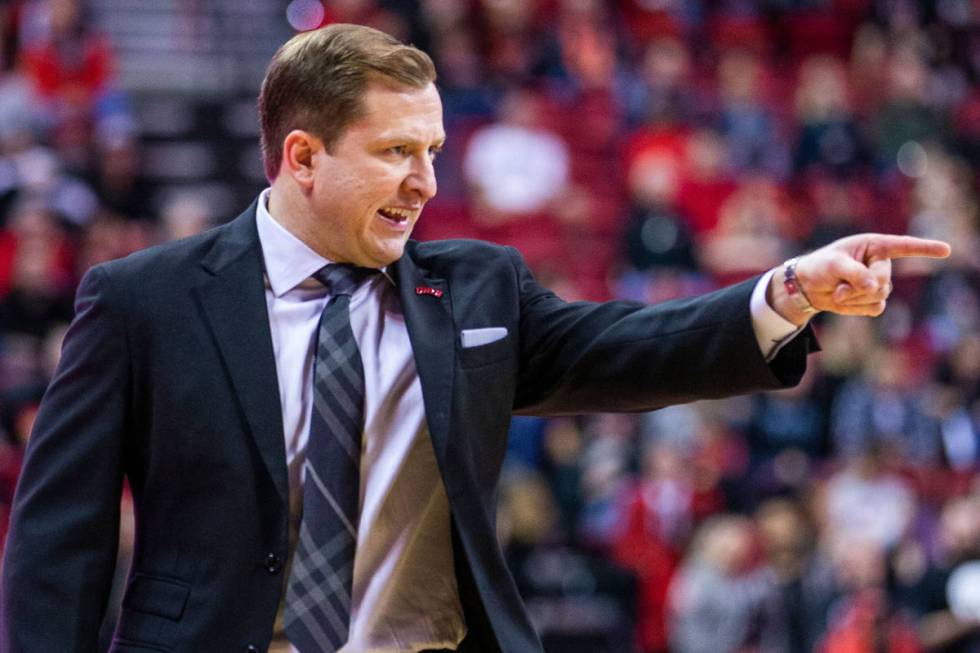 UNLV Rebels head coach T.J.Otzelberger directs his players on the court versus the New Mexico L ...