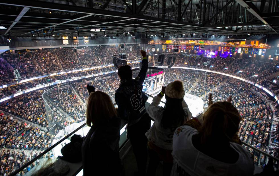 Golden Knights fans cheer from the Hyde Lounge space at T-Mobile Arena at the start of an NHL h ...