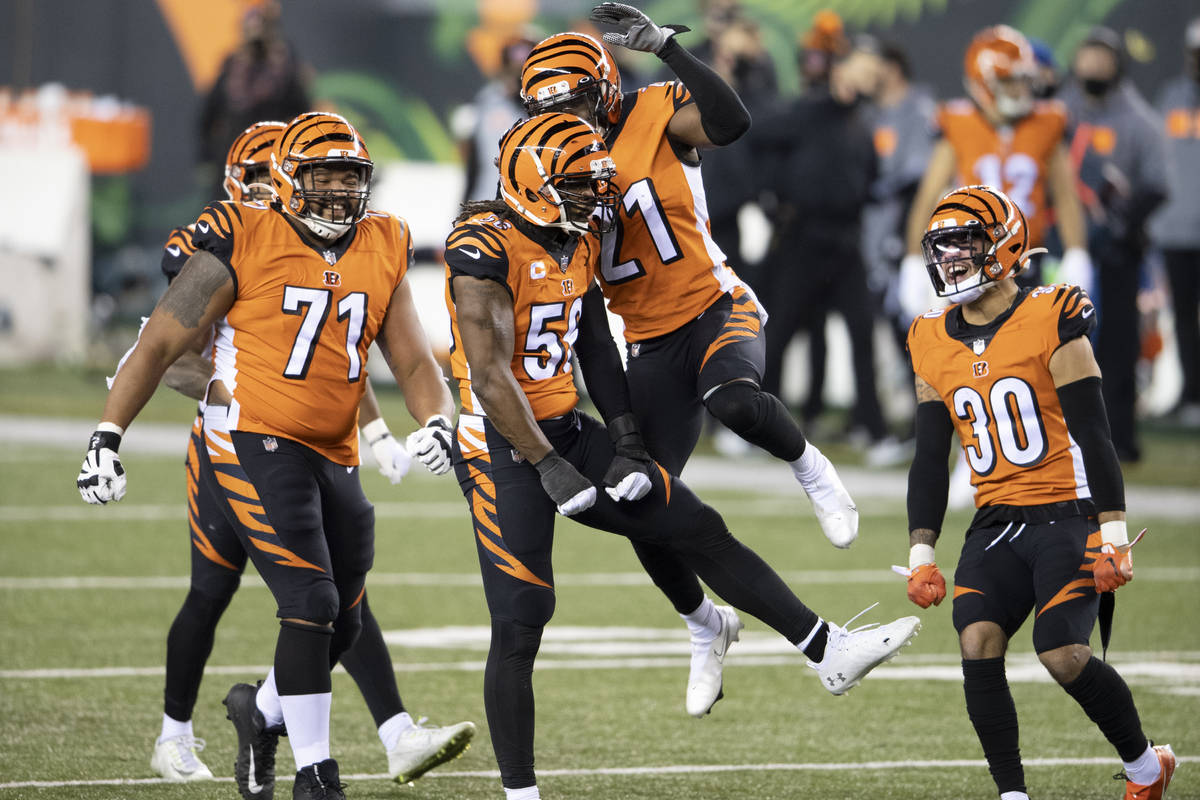 Cincinnati Bengals cornerback Mackensie Alexander (21), middle linebacker Josh Bynes (56), free ...