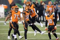 Cincinnati Bengals cornerback Mackensie Alexander (21), middle linebacker Josh Bynes (56), free ...