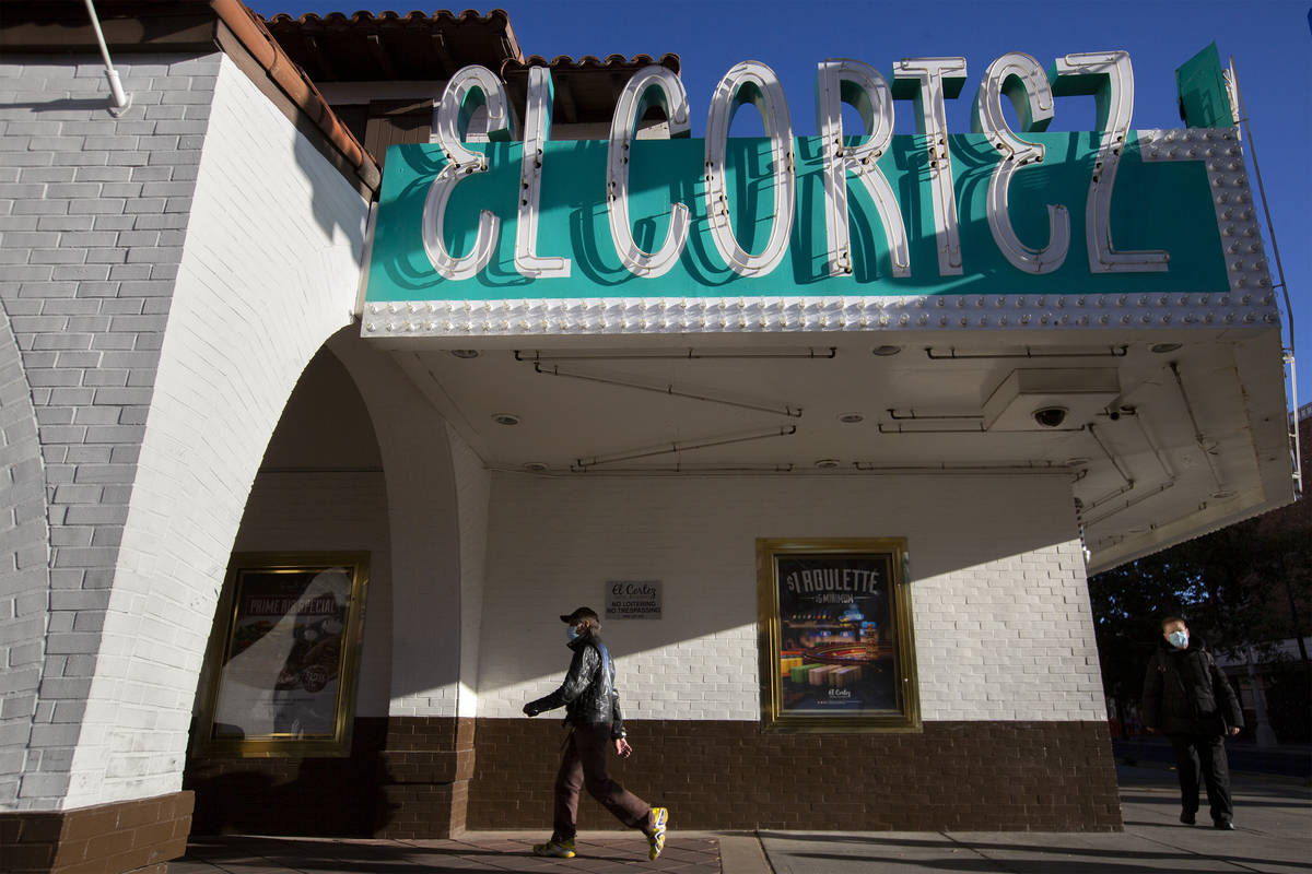 People walk past at the El Cortez hotel and casino, which has been operating since 1941 at its ...