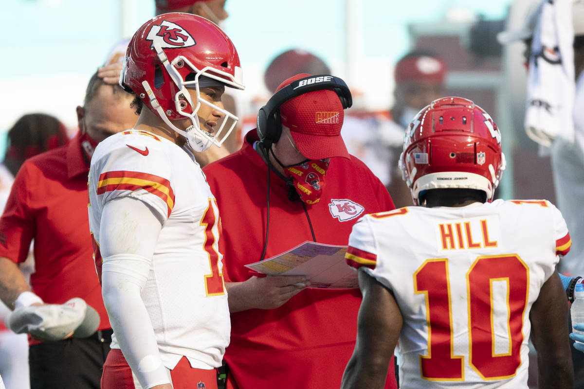 Kansas City Chiefs quarterback Patrick Mahomes (15) talks with Kansas City Chiefs head coach An ...