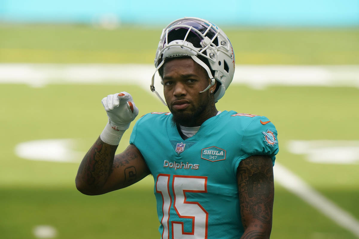 Miami Dolphins running back Lynn Bowden (15) warms up before an NFL football game against the C ...