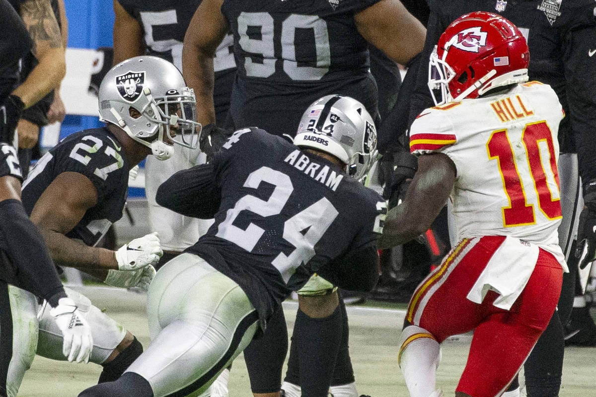 Las Vegas Raiders strong safety Johnathan Abram (24) lowers his shoulder to tackled Kansas City ...