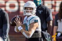 Coastal Carolina quarterback Grayson McCall (10) warms up before an NCAA college football game ...