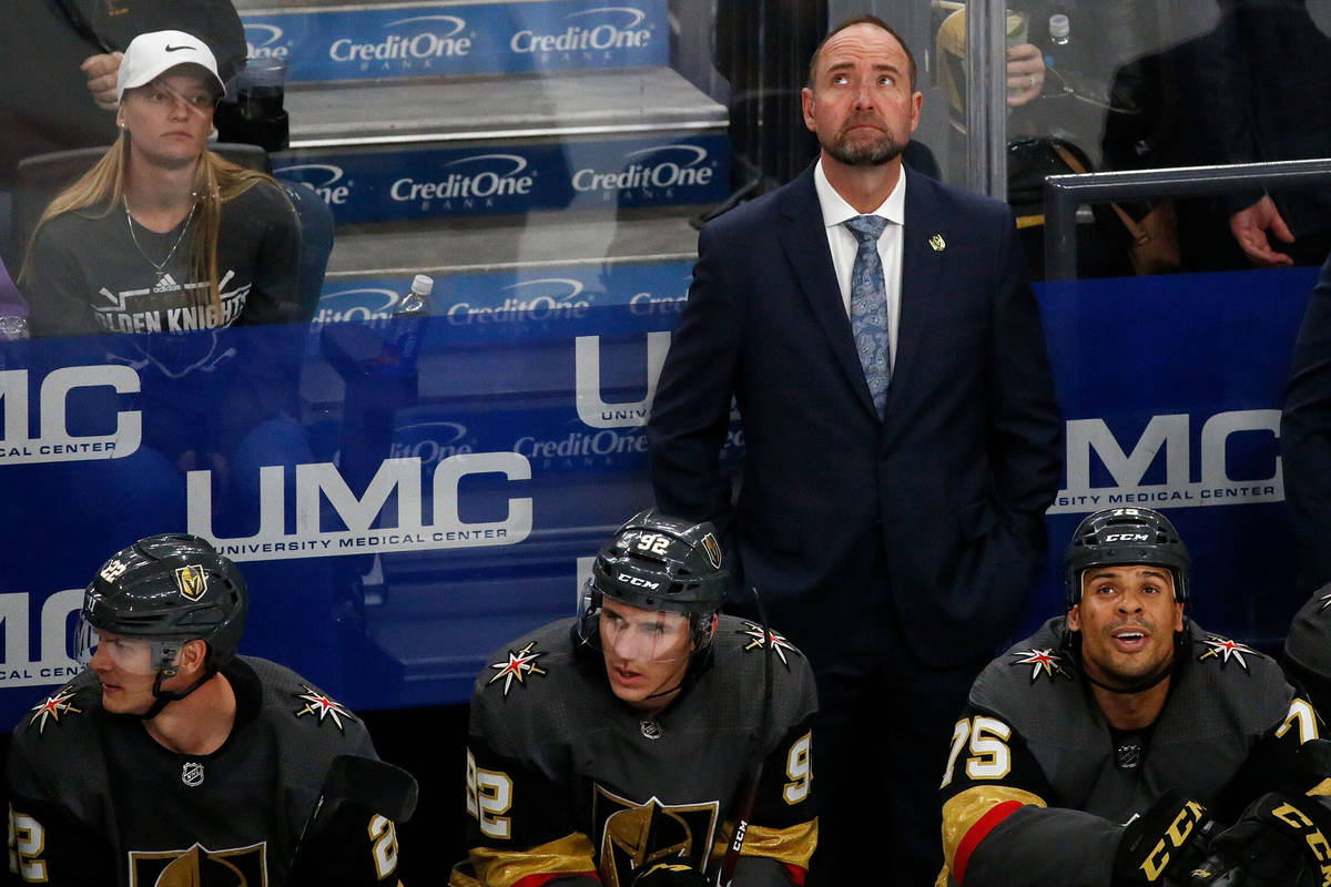 Vegas Golden Knights head coach Pete DeBoer looks up at the display board in the second period ...