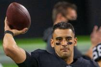 Raiders quarterback Marcus Mariota (8) warms up before entering the game against the Los Angele ...