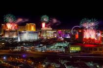 Fireworks for New Year's Eve erupt over the Strip as viewed from the VooDoo Rooftop Nightclub & ...