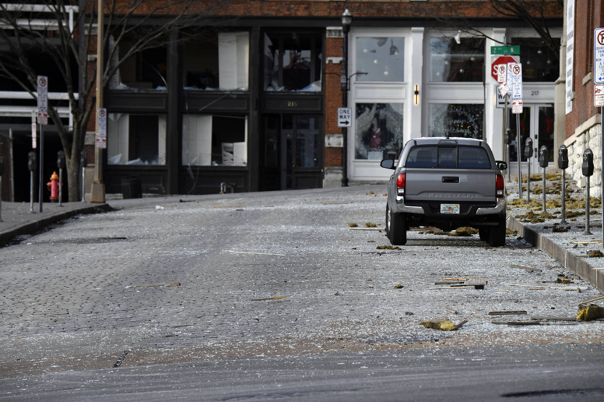 Glass from broken windows litters Bank Street at Second Avenue following the explosion in the a ...