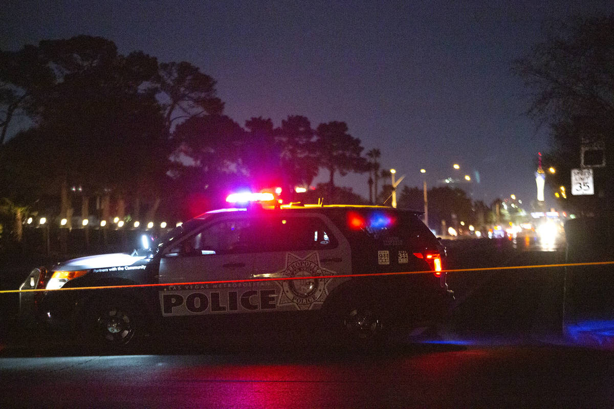 Metropolitan police monitor the scene at Bermuda Road and East Windmill Lane, where a motorcycl ...