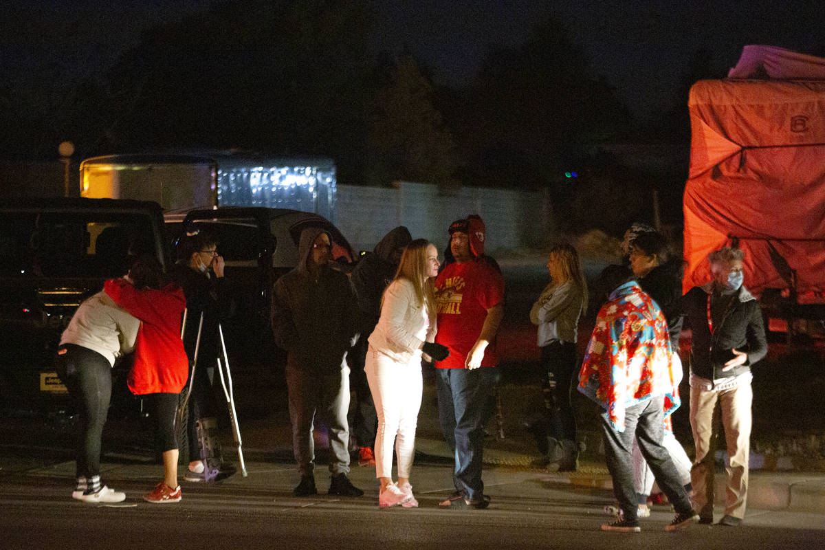 People gather near the scene at Bermuda Road and East Windmill Lane, where a motorcycle rider w ...