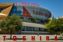 A pedestrian walks in front of the T-Mobile Arena a block off the Las Vegas Strip on Friday, Ma ...