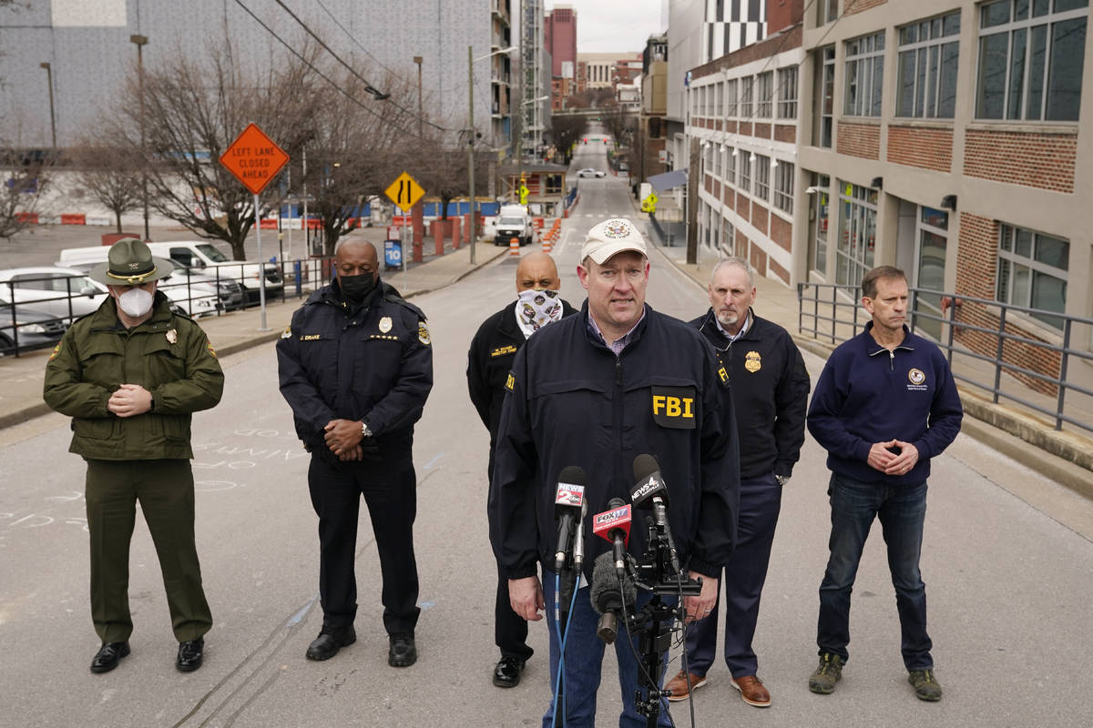 FBI Assistant Special Agent in Charge Matthew Foster, center, speaks during a news conference F ...