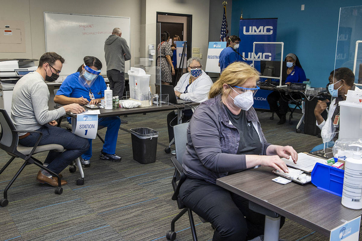 University Medical Center front-line health care workers receive their Pfizer-BioNTech COVID-19 ...