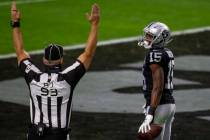 back judge Scott Helverson (93) signals touchdown after Raiders wide receiver Nelson Agholor (1 ...