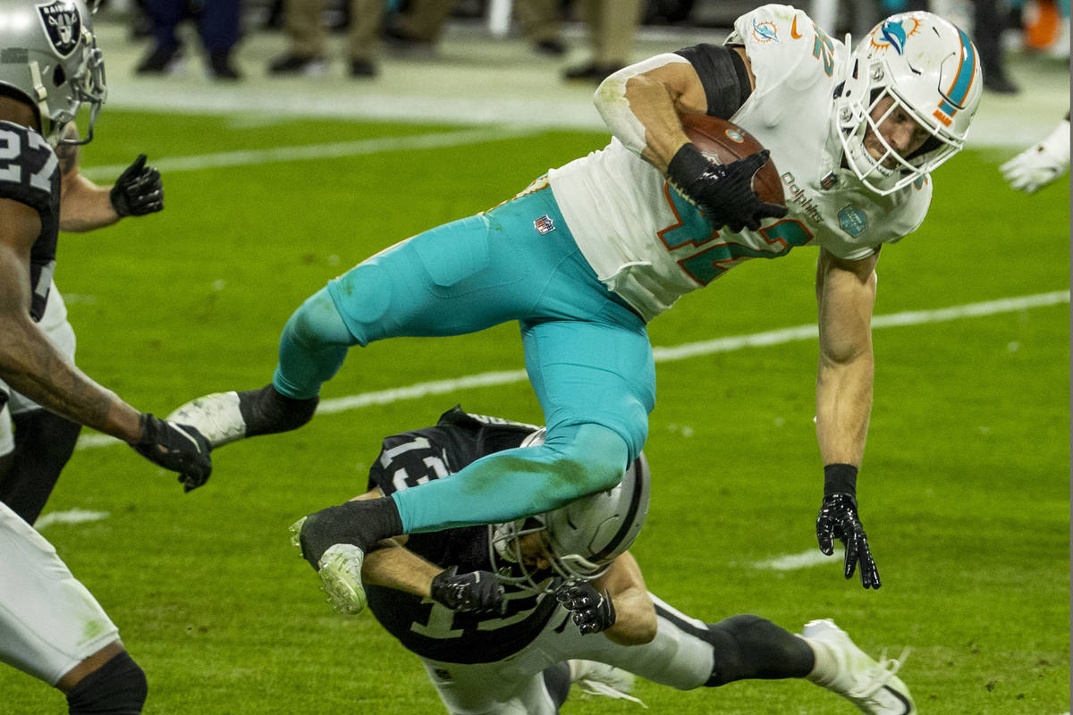 Miami Dolphins defensive back Clayton Fejedelem (42) is stopped on a touchdown run after a fake ...