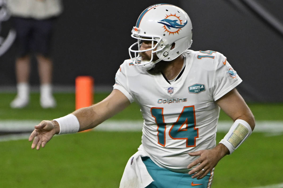 Miami Dolphins quarterback Ryan Fitzpatrick (14) plays against the Las Vegas Raiders during the ...