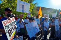 Protesters rally in favor of keeping the nickname Dixie, in St. George, Utah., in summer 2020. ...