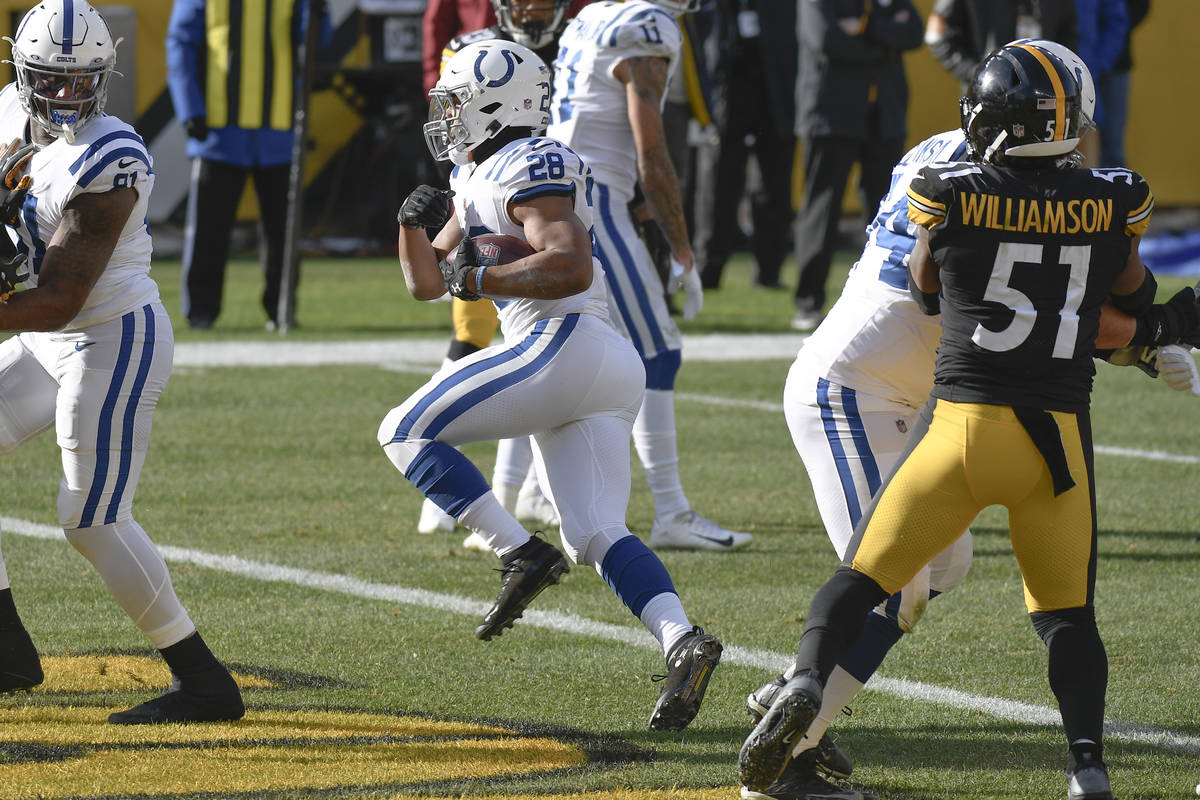 Indianapolis Colts running back Jonathan Taylor (28) scores a touchdown past Pittsburgh Steeler ...