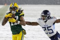 Green Bay Packers' Davante Adams catches a touchdown pass during the first half of an NFL footb ...