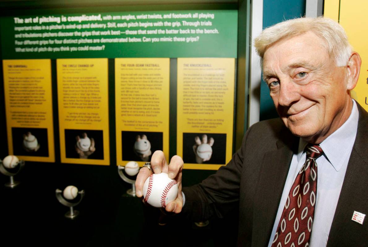 FILE - In this March 29, 2007, file photo, Baseball Hall of Famer Phil Niekro holds a knuckleba ...