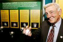 FILE - In this March 29, 2007, file photo, Baseball Hall of Famer Phil Niekro holds a knuckleba ...