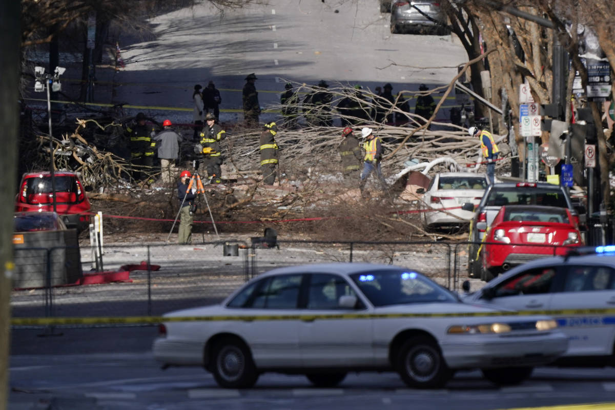 Investigators continue to examine the site of an explosion Sunday, Dec. 27, 2020, in downtown N ...
