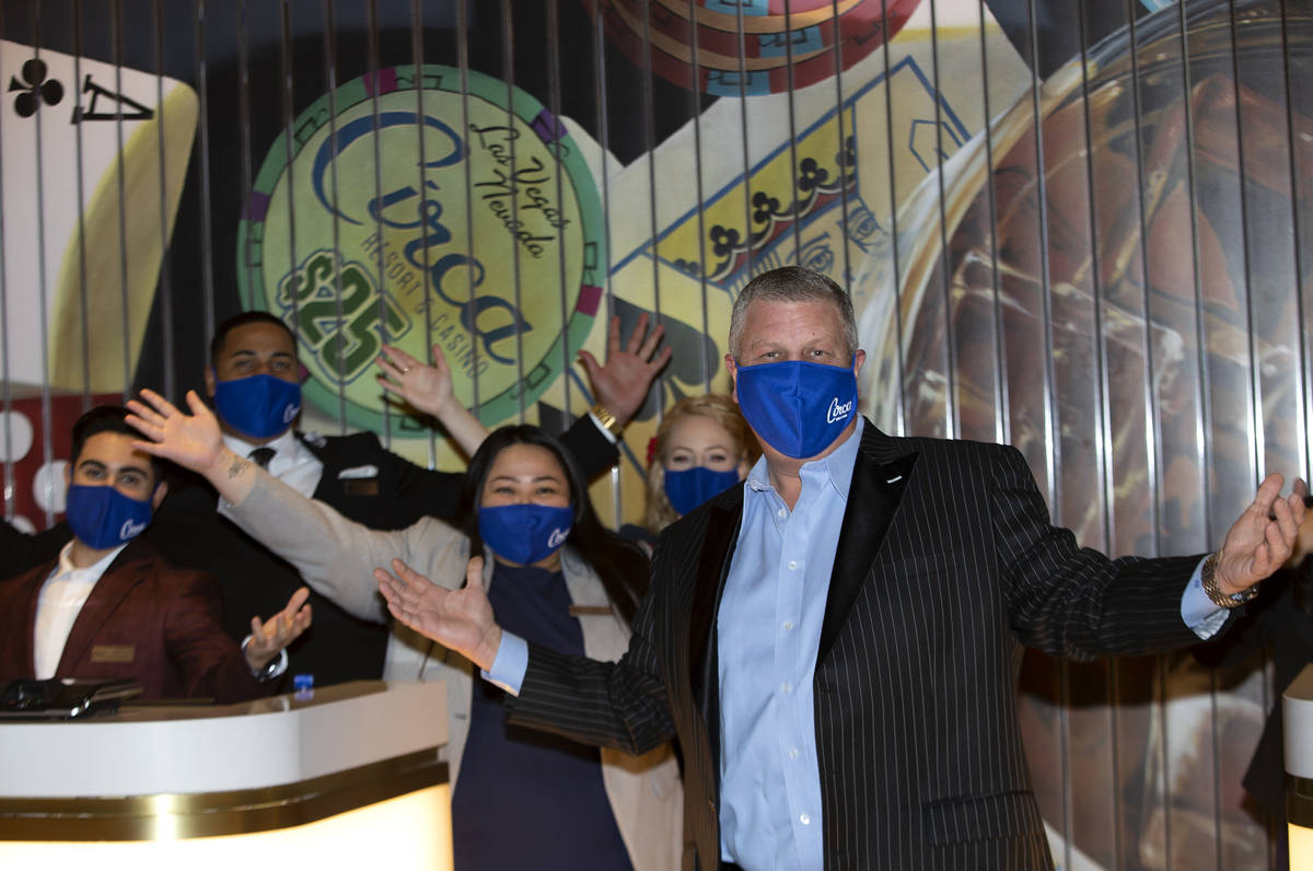 Circa casino owner Derek Stevens poses with front desk agents during one of the first days that ...