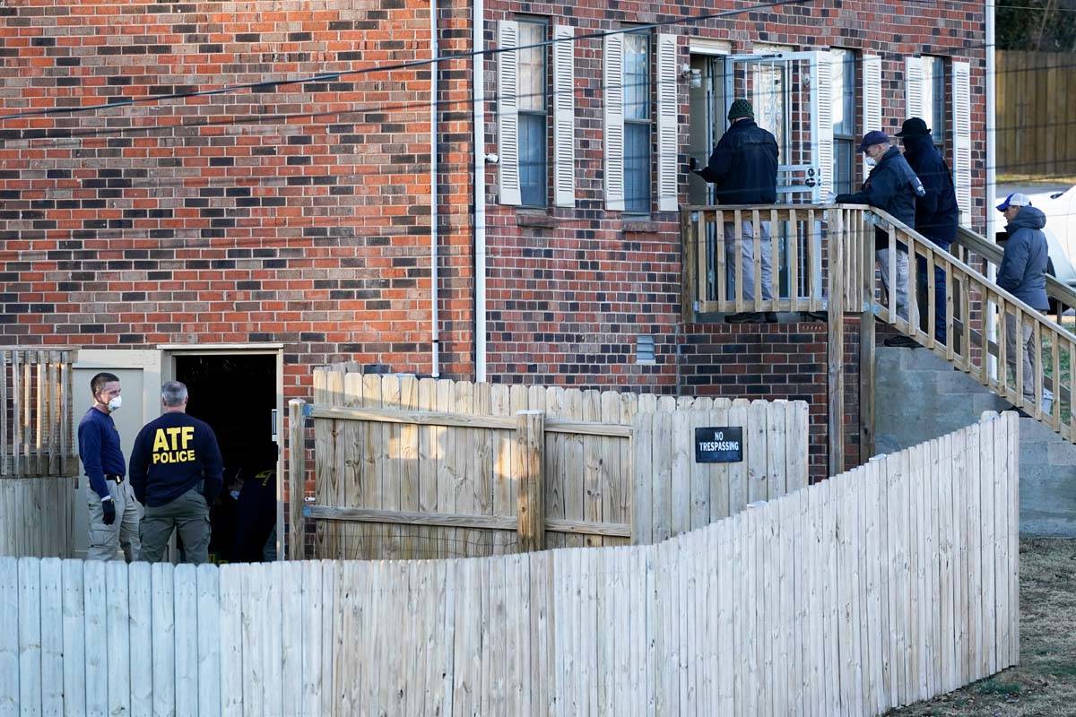 FBI and ATF agents investigate a home Saturday, Dec. 26, 2020, in Nashville, Tenn. An explosion ...