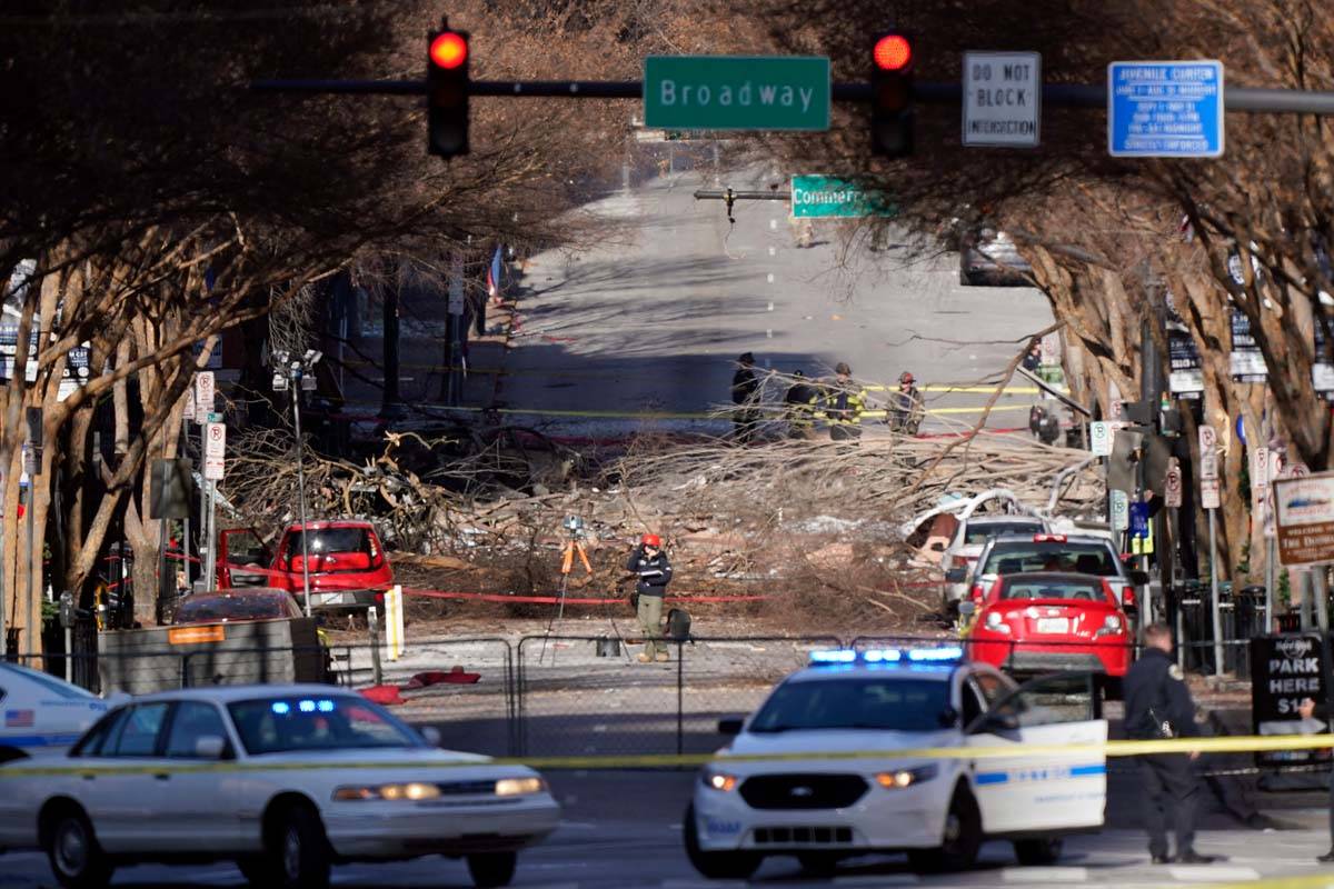 Investigators continue to examine the site of an explosion Sunday, Dec. 27, 2020, in downtown N ...