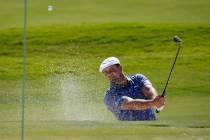 Bryson DeChambeau hits out of a bunker onto the ninth green during the final round of Shriners ...