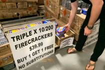 People shop for fireworks at Moapa Paiute Travel Plaza in Moapa on Tuesday, Dec. 29, 2020. (Eli ...
