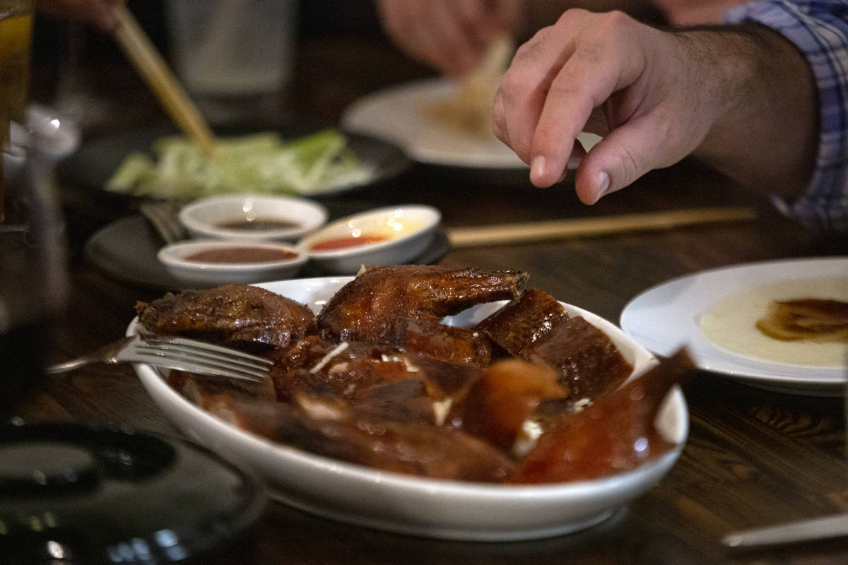 A Peking duck is served family-style at Chinglish Cantonese Wine Bar on Thursday, Dec. 24, 2020 ...