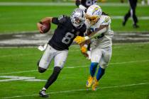 Raiders quarterback Marcus Mariota (8) runs with the football as Los Angeles Chargers strong sa ...