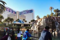 Visitors hang out in front of The Mirage on the Las Vegas Strip, Dec. 21, 2020. (Rachel Aston/ ...