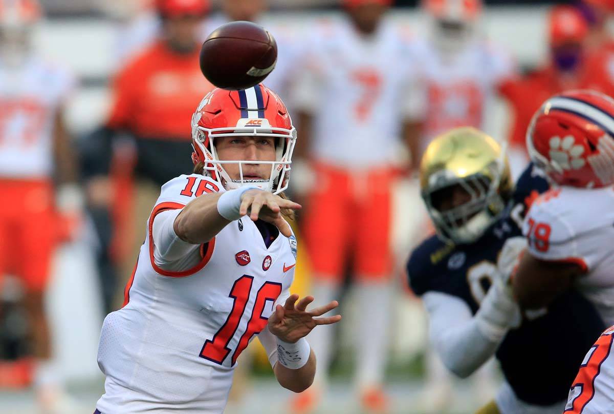 In this Saturday, Dec. 19, 2020, file photo, Clemson quarterback Trevor Lawrence (16) throws to ...