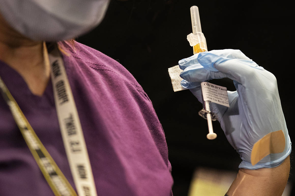A syringe containing the COVID-19 vaccine at the North Las Vegas VA Medical Center on Wednesday ...