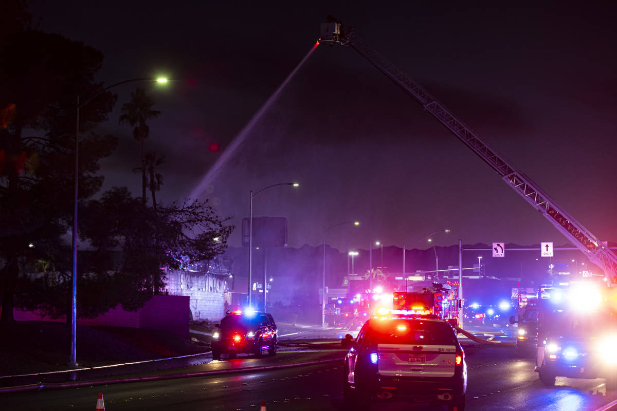 Las Vegas firefighters respond to a fire at a tire shop off Decatur Boulevard at Meadows Lane i ...