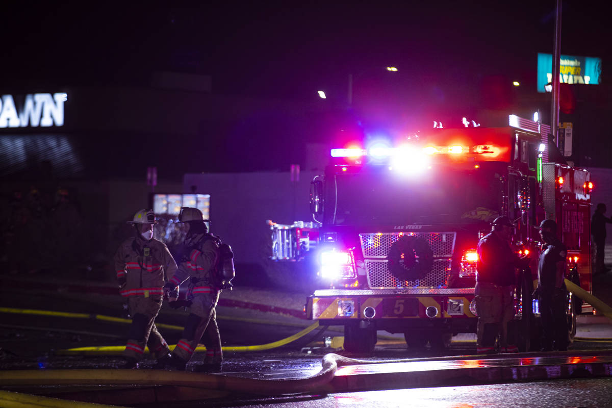 Las Vegas firefighters respond to a fire at a tire shop off Decatur Boulevard at Meadows Lane i ...