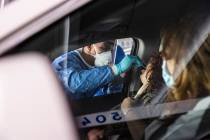 Nevada National Guard Spc. Demetrie Barnett takes a swab sample from Vanessa Aguayo-Barker to t ...