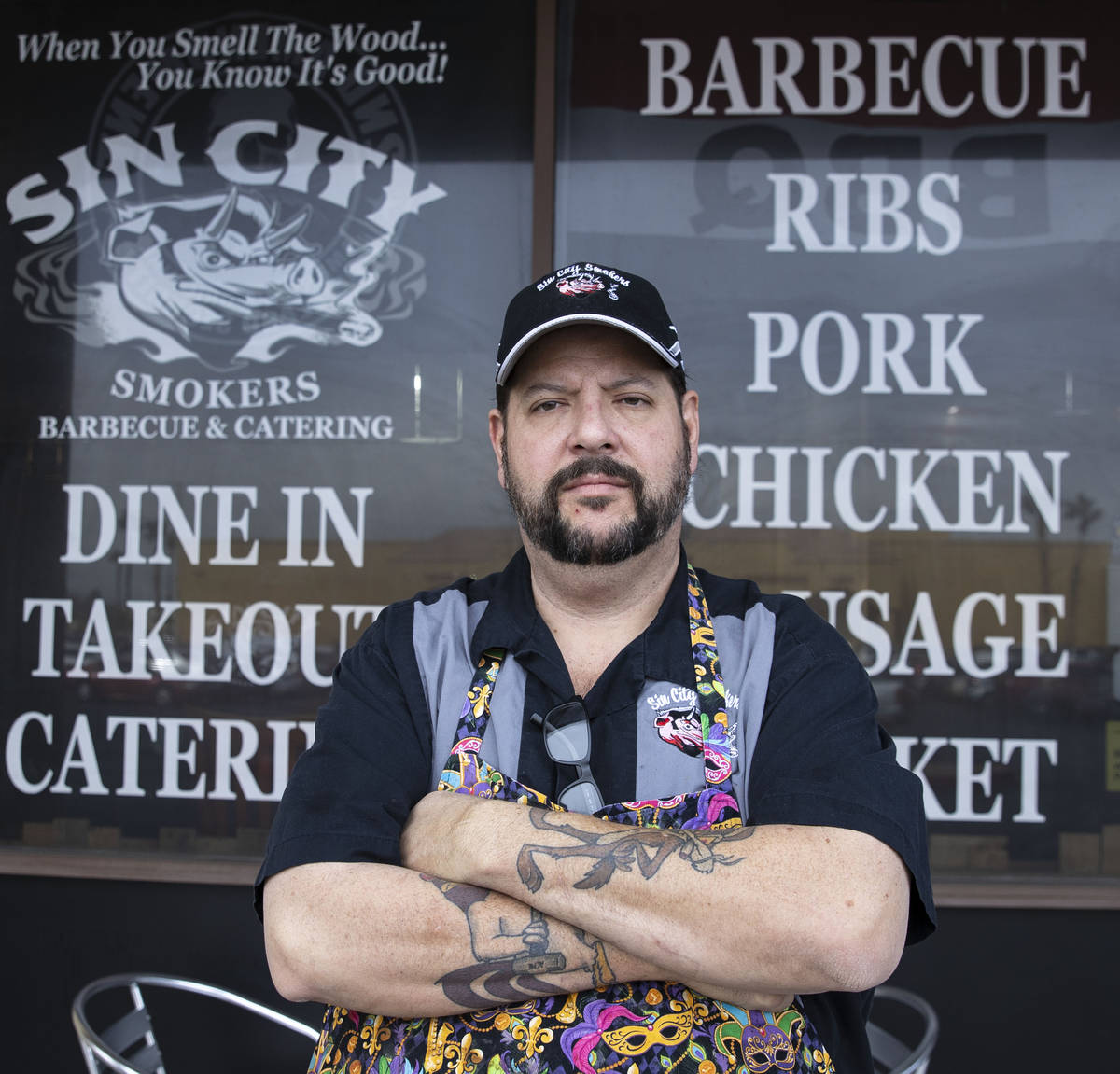 Steve Overlay, owner of Sin City Smokers Barbecue and Catering, poses for a photo outside of hi ...