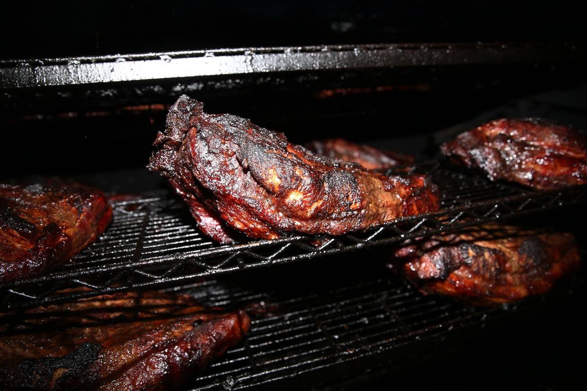 Briskets inside a pit at Big B's Texas BBQ in Henderson. (Erik Verduzco/Las Vegas Review-Journa ...