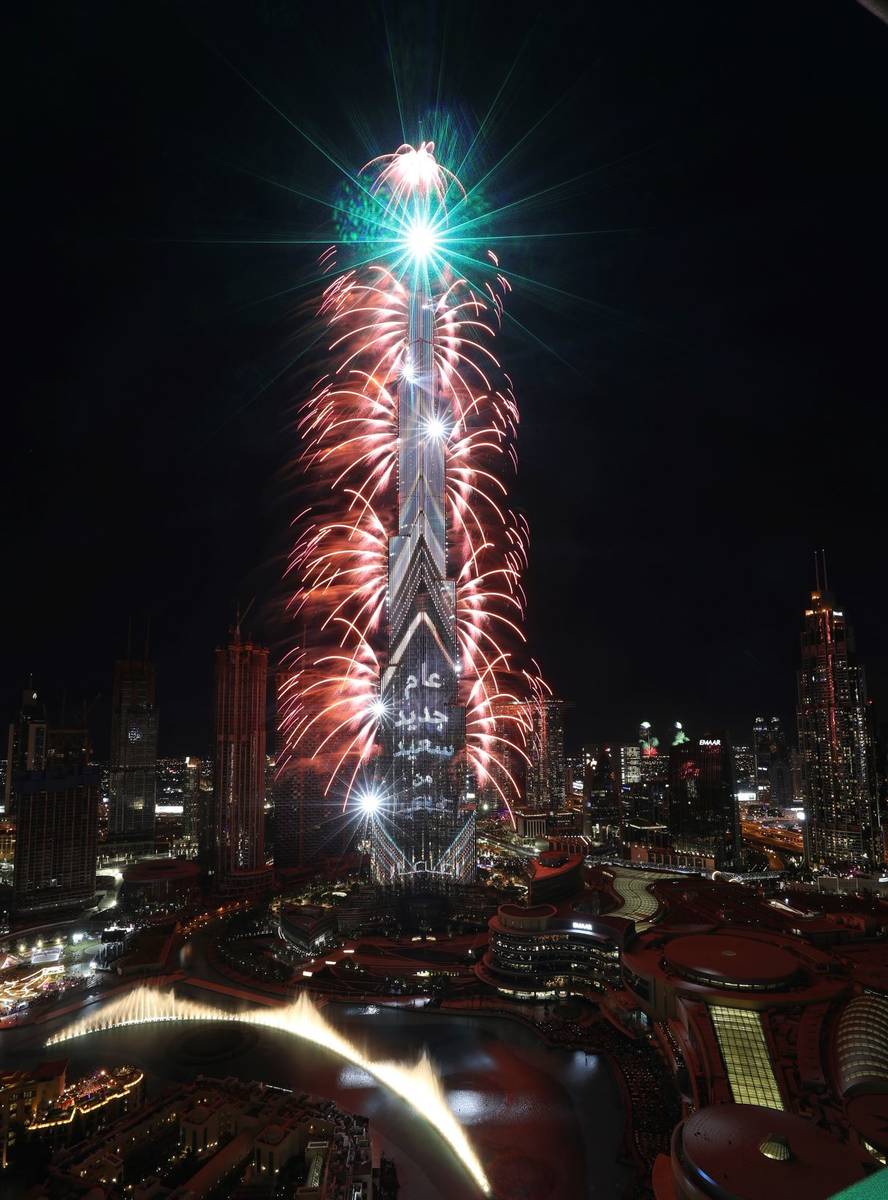 Fireworks explode at the Burj Khalifa, the world's tallest building, to mark New Year in Dubai, ...
