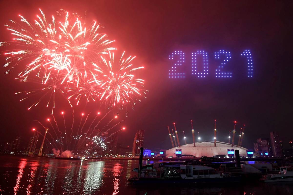 Fireworks and drones illuminate the night sky over London as they form a light display as Londo ...